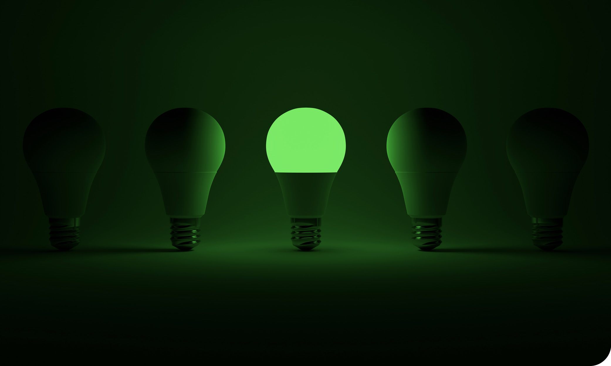 Green LED light bulb glowing among dark bulbs – symbolising energy efficiency, LED lighting installation and sustainable home solutions in Costa Brava.